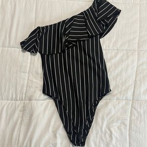 Black/white blouse. One shoulder.